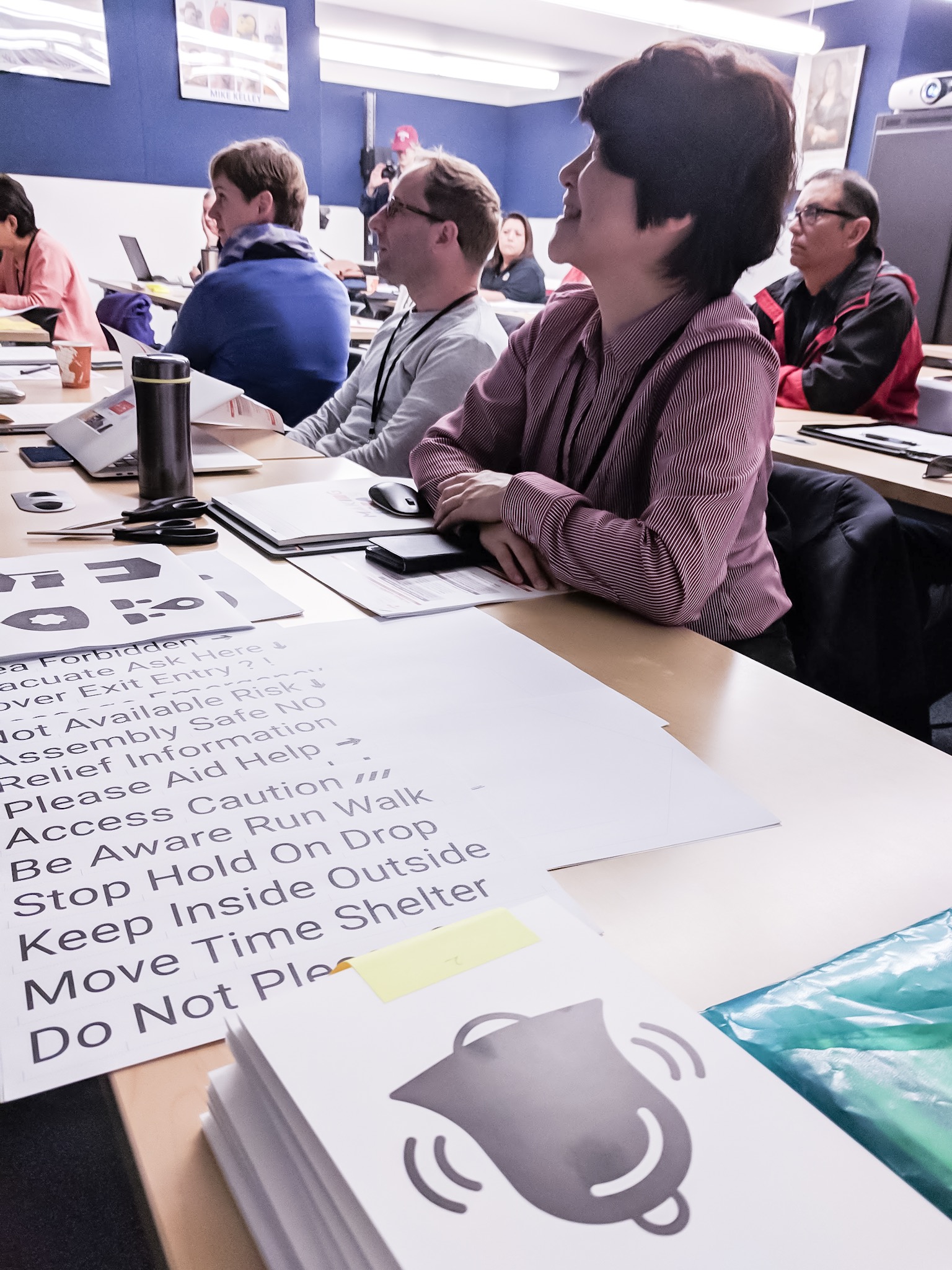Tingyi Lin, Klaus Kremer, and Saskia van Manen listening to a talk during the workshop.