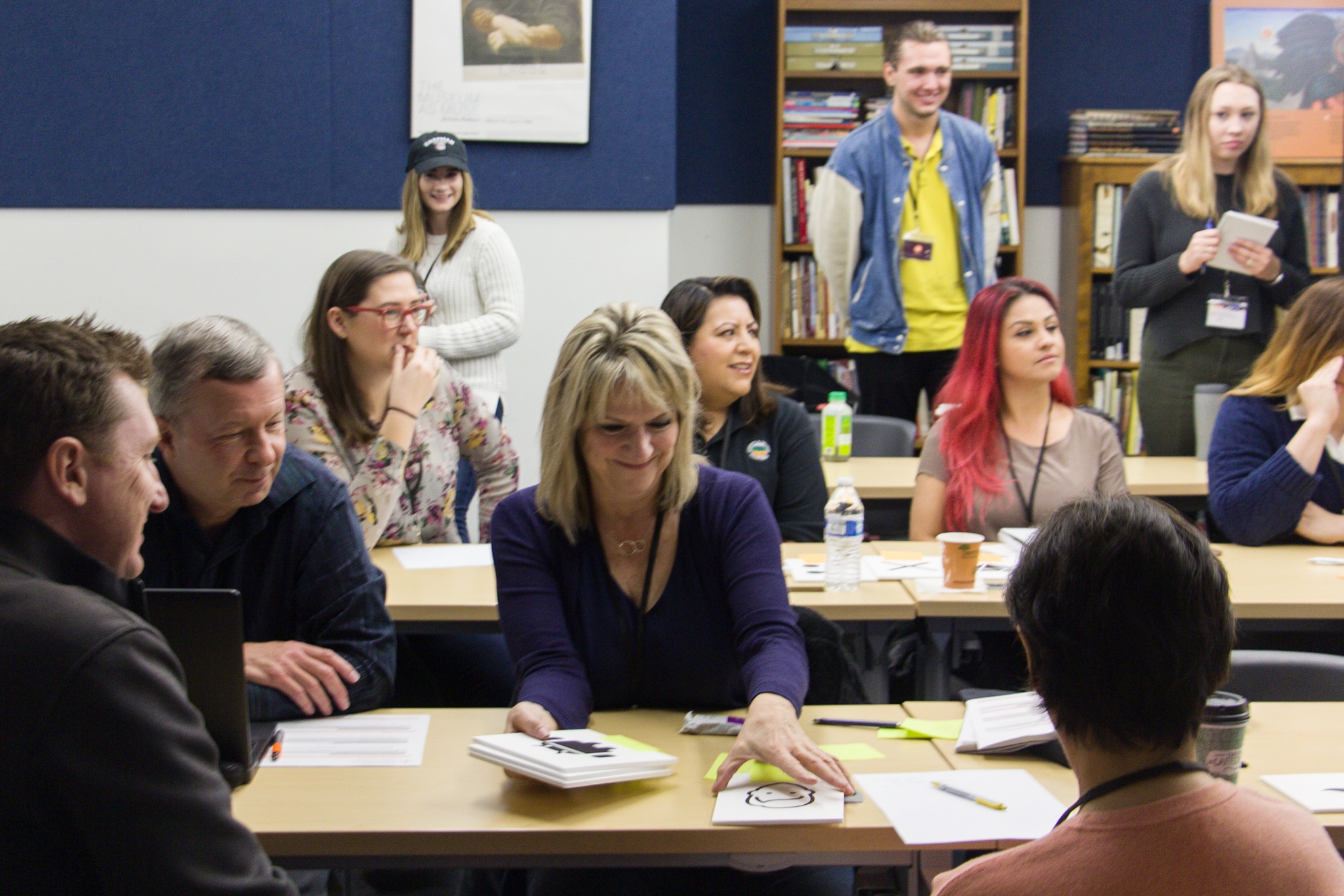 Room full of workshop participants working with visual storytelling exercise.