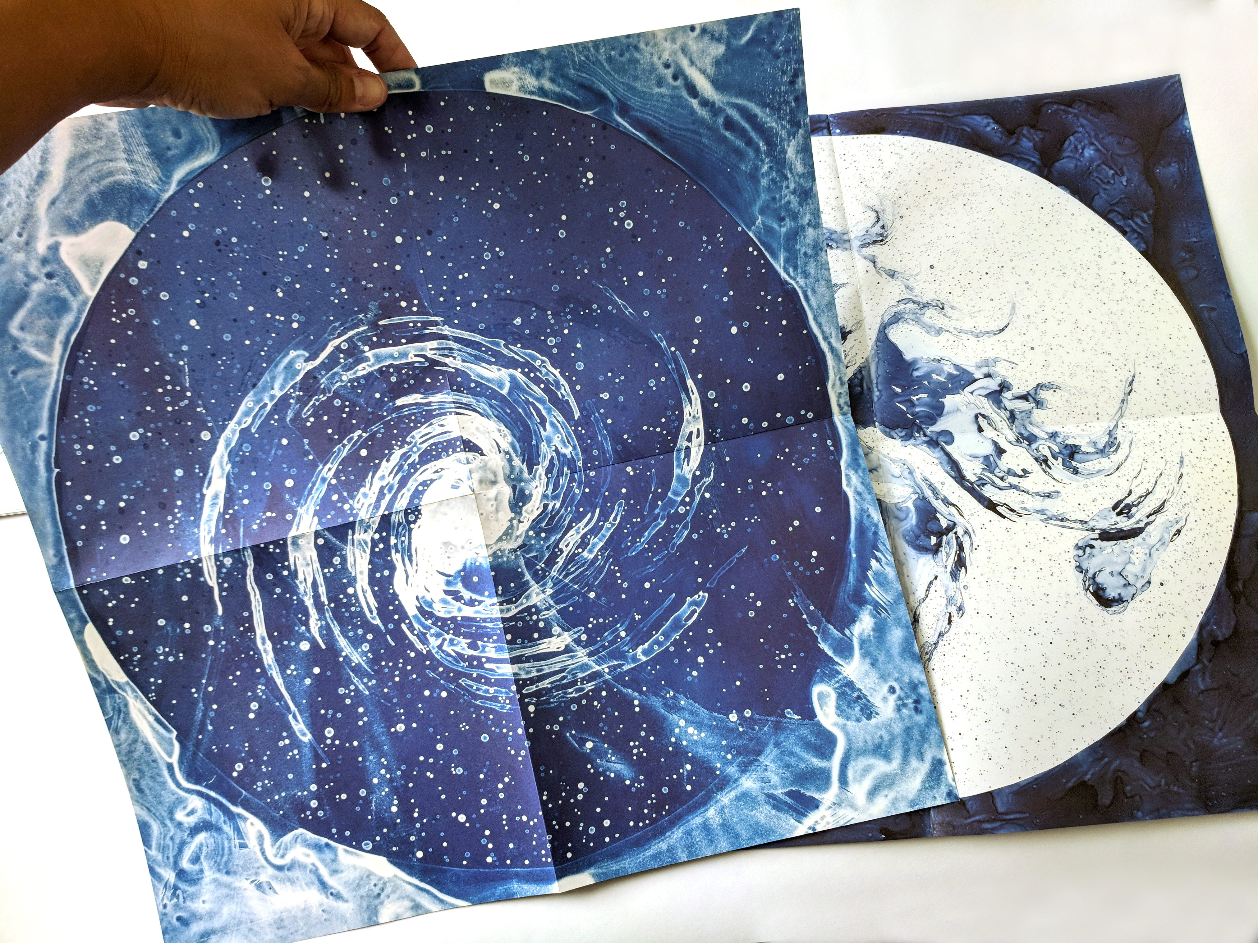 Two of the five opened poster—scale 18 x 18—of Lia's drawings.