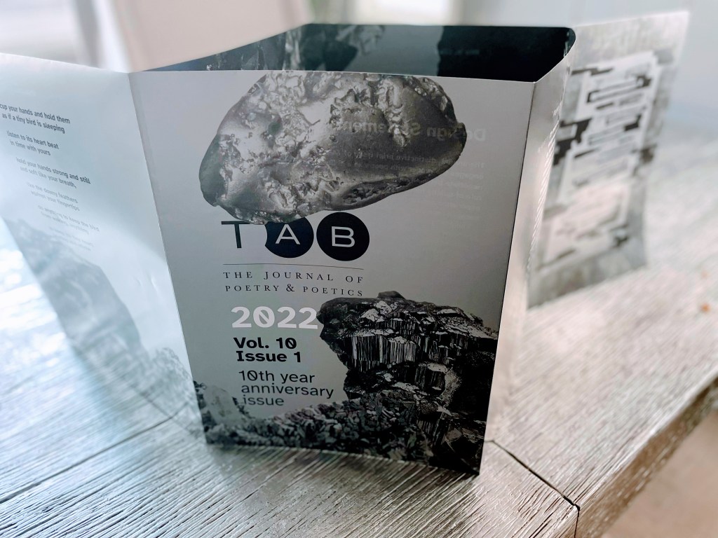 Poster booklet displayed on a table