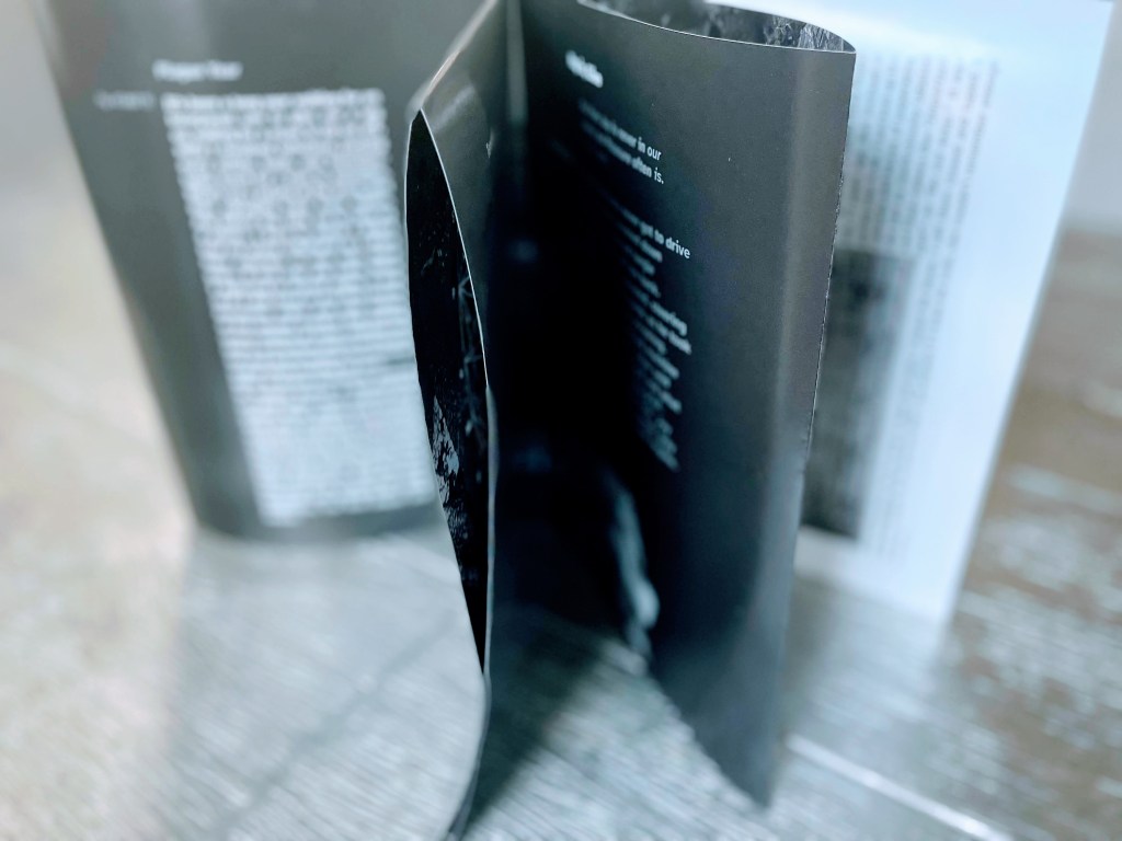 Close-up of fanned out pages displayed on a table